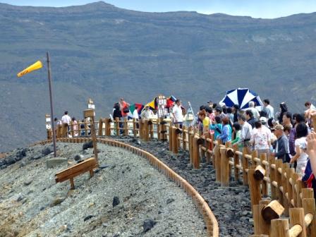 The viewing platform is on the top of the crater rim of Mount Aso (Kyushu, Japan). 
